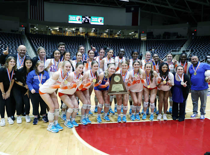 Nationally ranked Conroe Grand Oaks poses with the UIL Class 6A tournament trophy after shutting down Katy Cinco Ranch in an all-Houston area title.